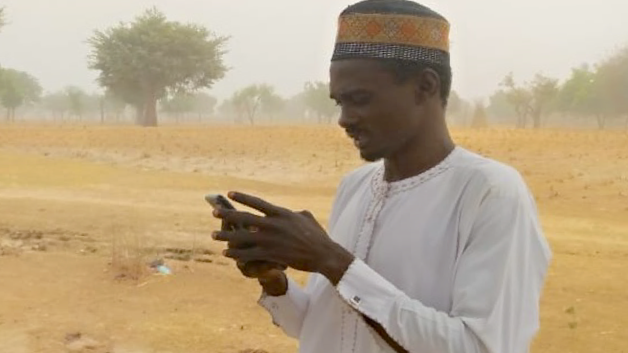 Nigerian man with phone